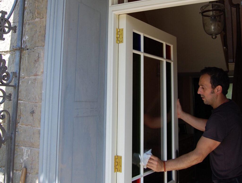 Final touches to replacement exterior door and overlight with external panelled reveal (primer only at this stage)
