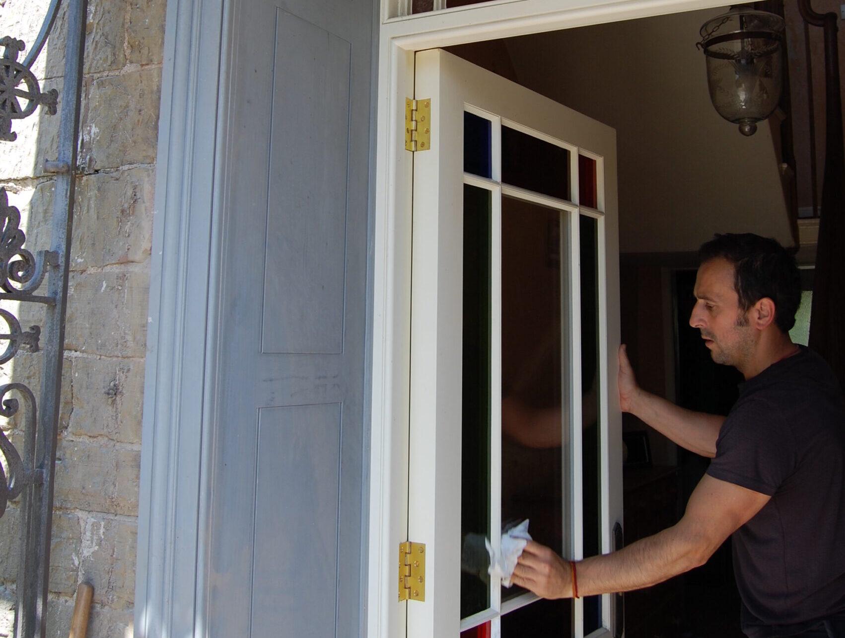 Final touches to replacement exterior door and overlight with external panelled reveal (primer only at this stage)