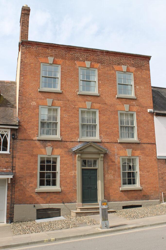 Front elevation of this grade II listed townhouse in central Ludlow, incorporating eight six over six replacement double glazed box sash windows