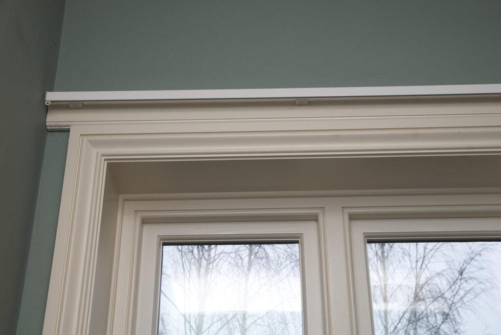 Internal detail of a double casement window with a plain reveal and full architrave
