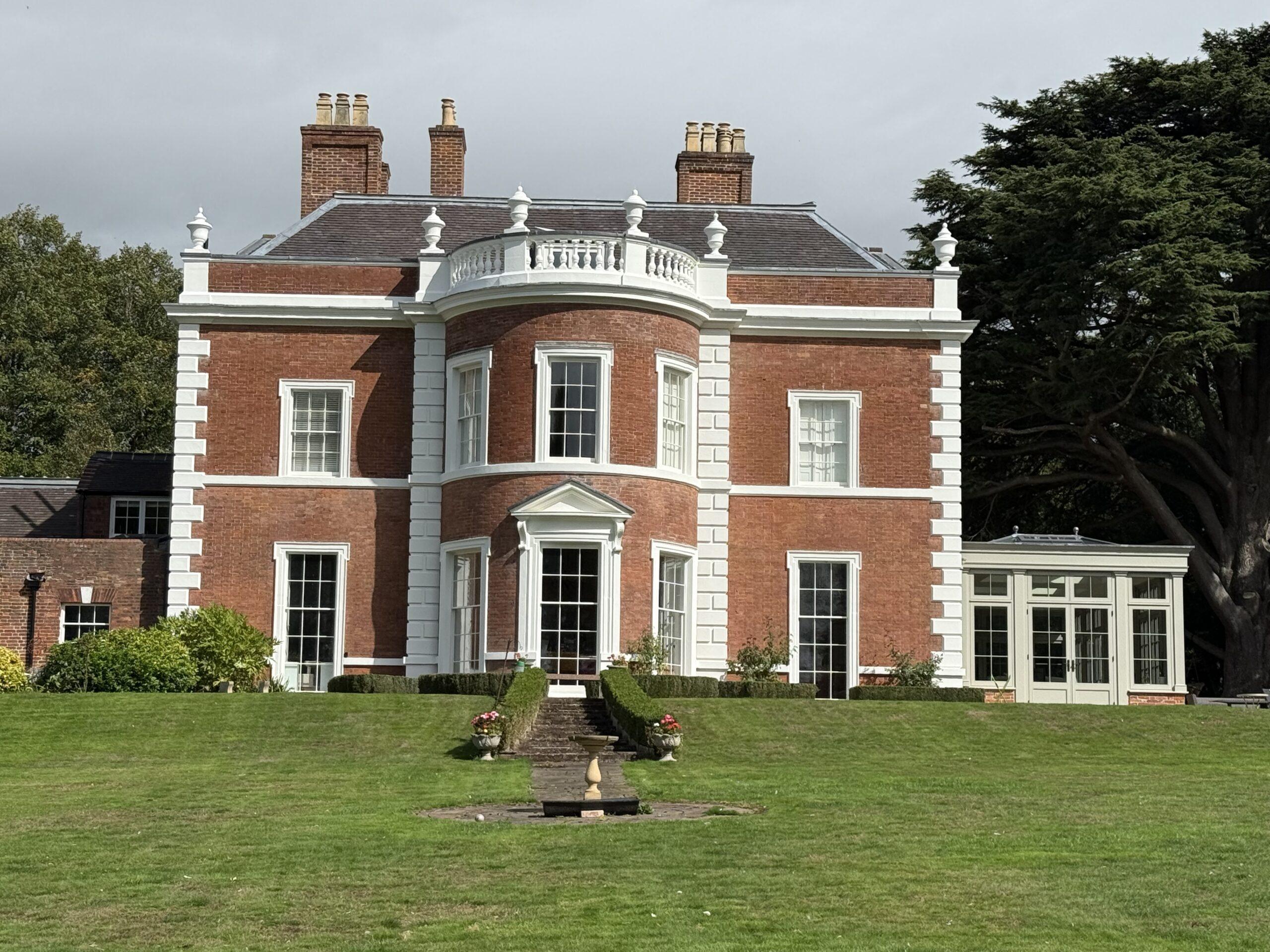 Bow-fronted 6 over 6 box sash windows