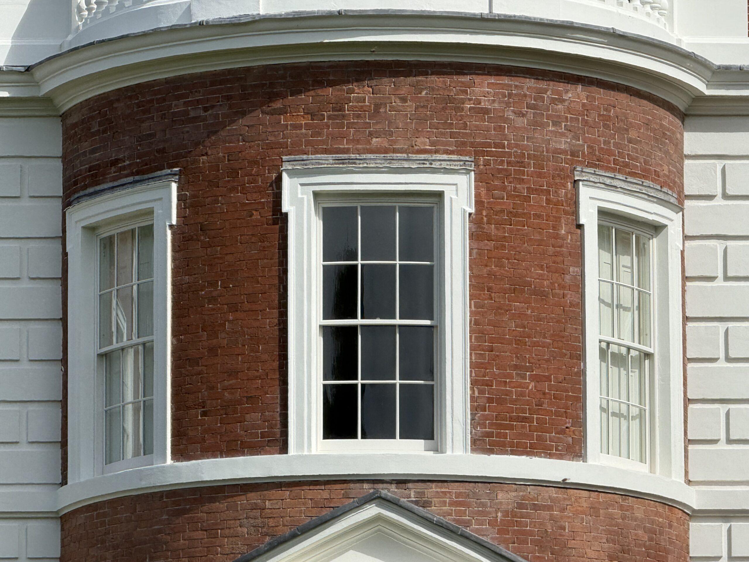 Bow-fronted 6 over 6 box sash windows